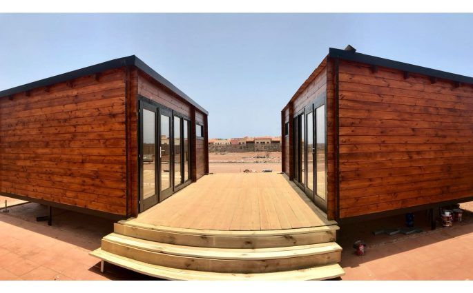 Cabañas de madera con techo plano - casas de clientes